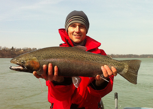 March 7, gold kwikfish.jpg - Matt from the Niagara holding a winter “holdover” Steelhead from the Niagara River caught on a Chartreuse and Black Flatfish..
